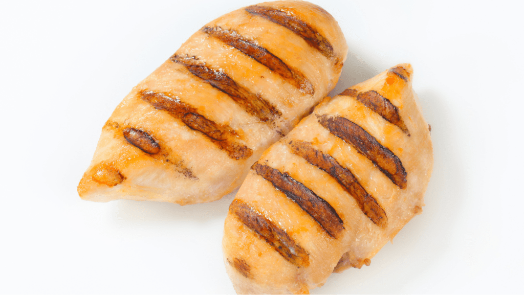 2 cooked chicken breasts on plate